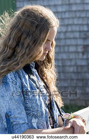 Stock Image - Side view of a girl, Green Gables, Prince Edward Island, Canada. Fotosearch