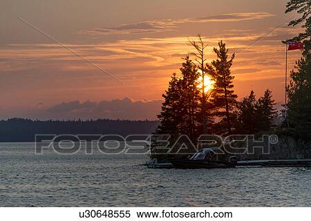 Silhouette of trees at the lakeside, Lake of The Woods, Ontario, Canada View Large Photo Image Stock Photography - Silhouette of trees at the lakeside, Lake of The Woods, Ontario, Canada. Fotosearch