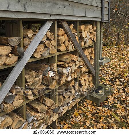 Stock Photograph - Stack of Firewood, Lake of The Woods, Ontario, Canada. Fotosearch