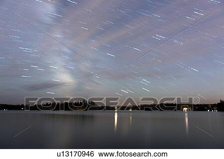 Star trails over a lake, Lake of The Woods, Ontario, Canada View Large Photo Image Stock Photograph - Star trails over a lake, Lake of The Woods, Ontario, Canada. Fotosearch