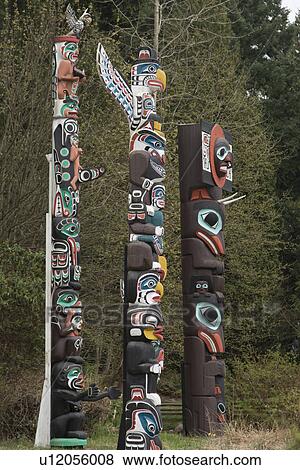 Stock Photo - Totem poles at Stanley Park, Vancouver, British Columbia, Canada. Fotosearch
