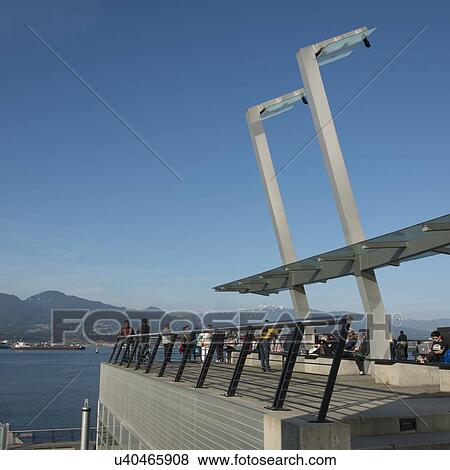 Stock Photo - Tourists at Vancouver Convention Centre, Vancouver, British Columbia, Canada. Fotosearch