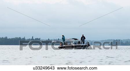 Tourists fishing from a boat, Lake of The Woods, Ontario, Canada View Large Photo Image Stock Image - Tourists fishing from a boat, Lake of The Woods, Ontario, Canada. Fotosearch