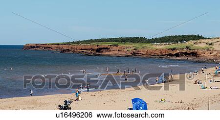 Stock Photograph - Tourists on the beach, Cavendish Beach, Green Gables, Prince Edward Island, Canada. Fotosearch