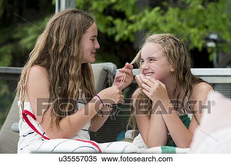 Two girls having fun, Lake of The Woods, Ontario, Canada View Large Photo Image Stock Photography - Two girls having fun, Lake of The Woods, Ontario, Canada. Fotosearch
