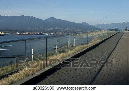 Stock Image - View of North Vancouver with mountains in the background, Coal Harbour, Vancouver, British Columbia, Canada. Fotosearch
