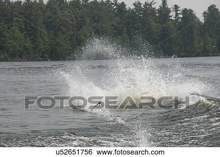 Stock Photograph - Water splashing in a lake, Lake of The Woods, Ontario, Canada. Fotosearch