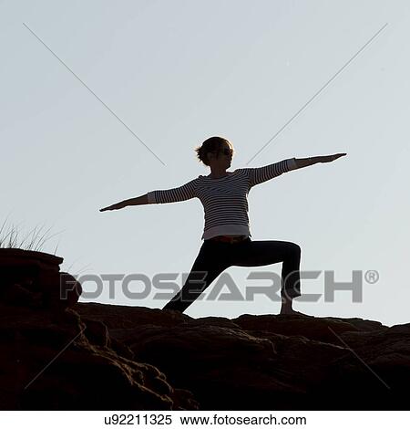 Woman exercising on rocky coastline, Green Gables, Cavendish, Prince Edward Island, Canada View Large Photo Image Stock Photography - Woman exercising on rocky coastline, Green Gables, Cavendish, Prince Edward Island, Canada. Fotosearch