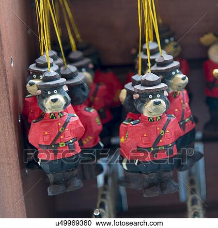 Stock Image - Wooden crafted sculptures for sale at market stall, Vancouver, British Columbia, Canada. Fotosearch