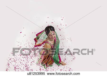 A beautiful bride showered with rose petals View Large Photo Image Stock Photography - A beautiful bride showered with rose petals. Fotosearch