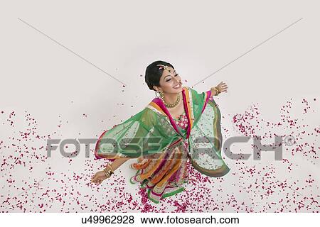 A beautiful bride surrounded by rose petals View Large Photo Image Stock Photo - A beautiful bride surrounded by rose petals. Fotosearch