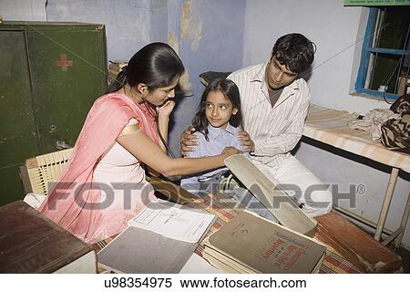 Stock Photography - A doctor examines her young patient . Fotosearch