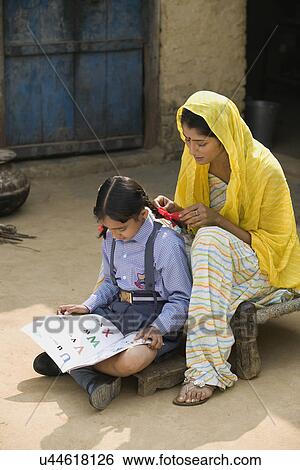 A rural mother sitting with her daughter View Large Photo Image Stock Photograph - A rural mother sitting with her daughter . Fotosearch