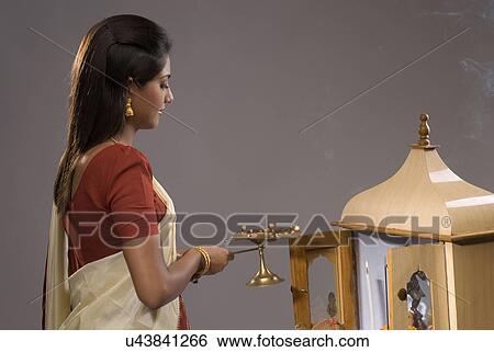 Stock Photograph - A woman praying . Fotosearch