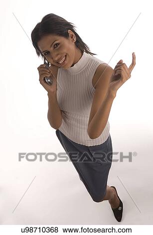 Stock Photo - A woman talking on the phone . Fotosearch