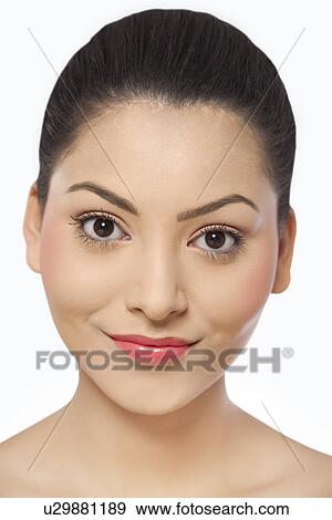 An attractive young woman over white background View Large Photo Image Stock Photo - An attractive young woman over white background . Fotosearch
