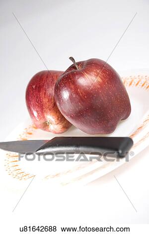 Stock Photo - Apples with a knife . Fotosearch