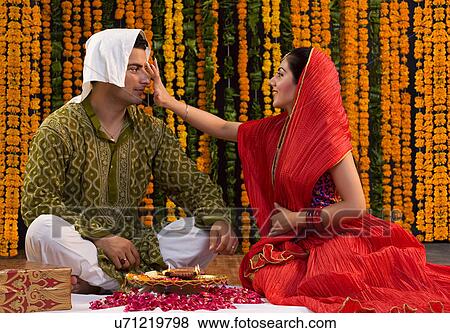 Stock Photo - Applying a tika . Fotosearch