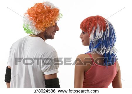 Back view of youngsters wearing wigs View Large Photo Image Stock Photograph - Back view of youngsters wearing wigs . Fotosearch