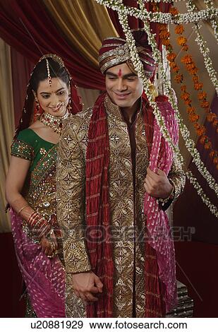 Beautiful young couple during mangal phera View Large Photo Image Stock Photo - Beautiful young couple during mangal phera . Fotosearch