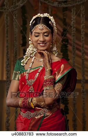 Beautiful young woman in bride attire smiling View Large Photo Image Stock Image - Beautiful young woman in bride attire smiling . Fotosearch