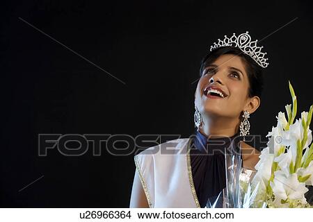 Picture - Beauty queen with a bouquet of flowers . Fotosearch