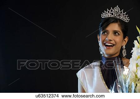 Beauty queen with a bouquet of flowers View Large Photo Image Picture - Beauty queen with a bouquet of flowers . Fotosearch
