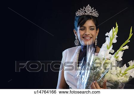 Beauty queen with a bouquet of flowers View Large Photo Image Stock Photograph - Beauty queen with a bouquet of flowers . Fotosearch