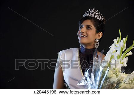 Beauty queen with a bouquet of flowers View Large Photo Image Stock Photograph - Beauty queen with a bouquet of flowers . Fotosearch