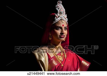 Stock Image - Bengali bride with a topor . Fotosearch
