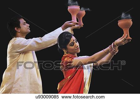 Stock Photography - Bengali couple doing a Dhunuchi dance . Fotosearch