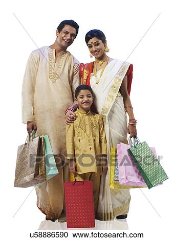 Stock Image - Bengali family with shopping bags . Fotosearch