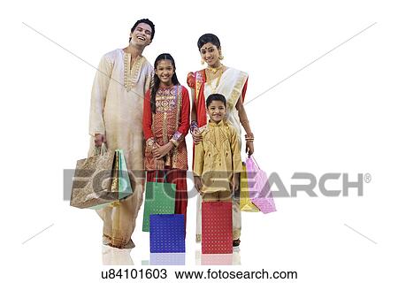 Stock Image - Bengali family with shopping bags . Fotosearch