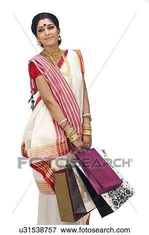 Stock Photo - Bengali woman carrying shopping bags. Fotosearch