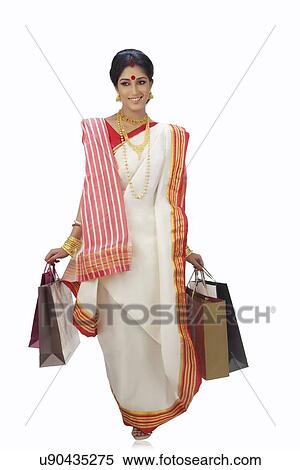 Bengali woman carrying shopping bags View Large Photo Image Stock Photography - Bengali woman carrying shopping bags. Fotosearch