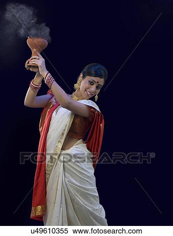Stock Photography - Bengali woman doing a Dhunuchi dance . Fotosearch