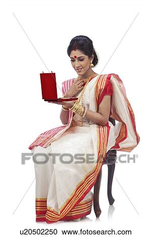 Bengali woman holding a jewelery box View Large Photo Image Stock Image - Bengali woman holding a jewelery box. Fotosearch