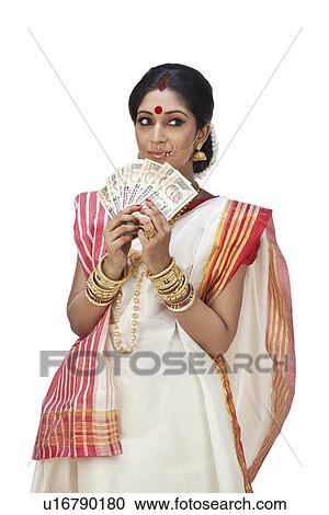 Bengali woman holding currency notes View Large Photo Image Stock Image - Bengali woman holding currency notes. Fotosearch