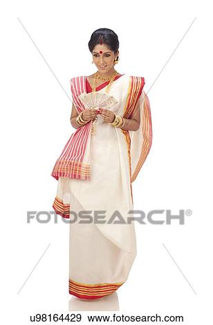 Stock Photo - Bengali woman holding currency notes . Fotosearch