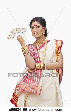 Stock Photography - Bengali woman holding currency notes. Fotosearch