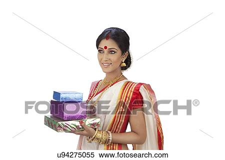 Bengali woman holding gifts View Large Photo Image Stock Photography - Bengali woman holding gifts. Fotosearch