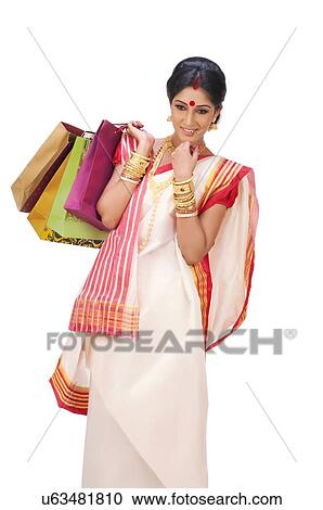 Bengali woman holding shopping bags View Large Photo Image Stock Image - Bengali woman holding shopping bags. Fotosearch