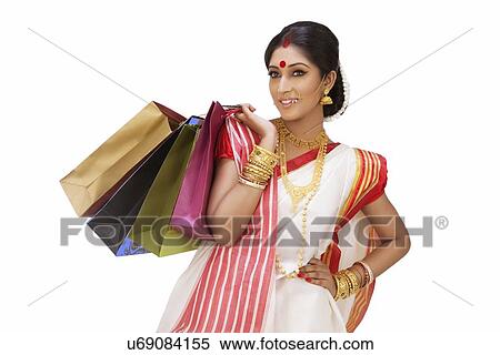 Bengali woman holding shopping bags View Large Photo Image Stock Photography - Bengali woman holding shopping bags. Fotosearch