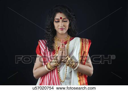 Bengali woman praying View Large Photo Image Picture - Bengali woman praying. Fotosearch