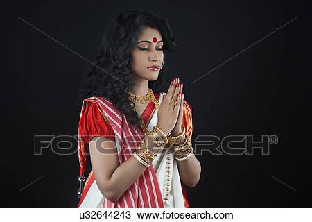 Bengali woman praying View Large Photo Image Stock Image - Bengali woman praying. Fotosearch
