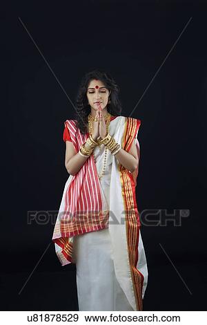 Stock Photo - Bengali woman praying. Fotosearch