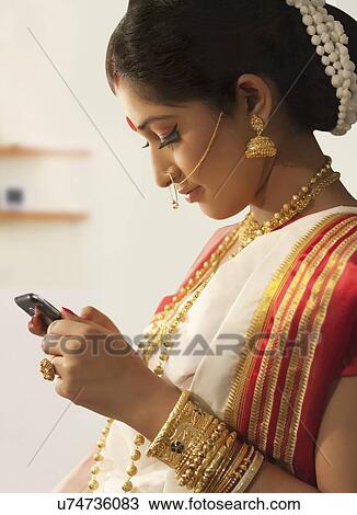 Bengali woman reading an sms View Large Photo Image Stock Image - Bengali woman reading an sms. Fotosearch