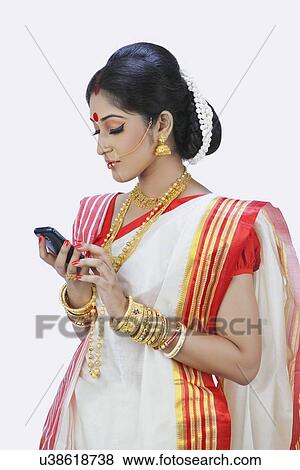 Stock Photo - Bengali woman reading an sms. Fotosearch