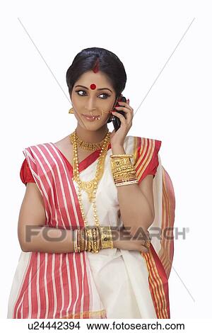 Bengali woman talking on a mobile phone View Large Photo Image Picture - Bengali woman talking on a mobile phone . Fotosearch