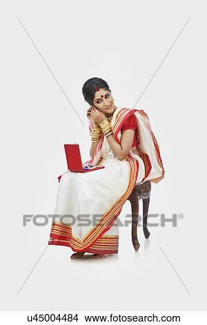 Bengali woman wearing jewelery View Large Photo Image Picture - Bengali woman wearing jewelery . Fotosearch